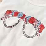 Uylee's Boutique Graphic Tie Hem Top and Floral Flare Pants Set
